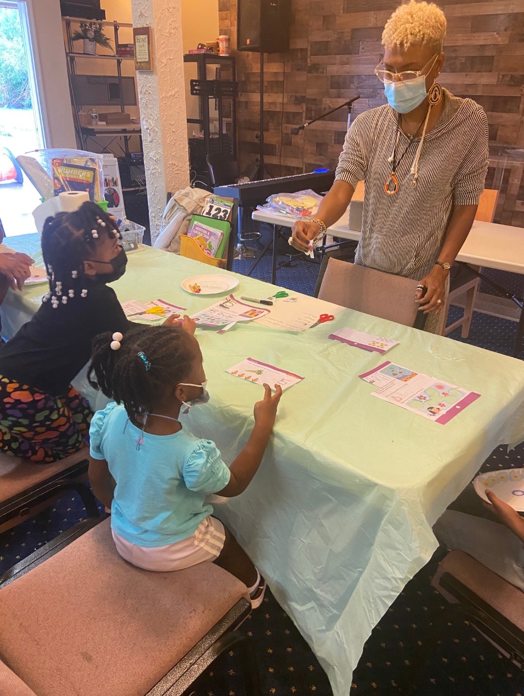 Dr. GwenJ guiding young students through a hands-on numbers activity